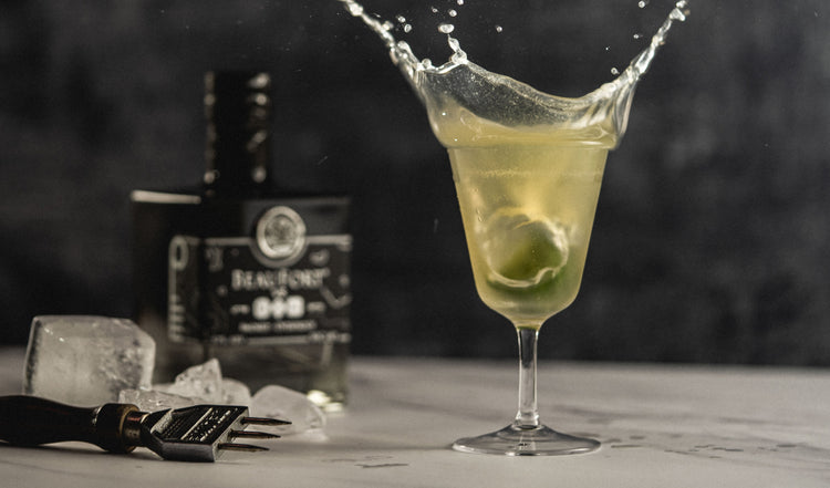 BeauFort vs Gin cocktail with lime splashing 
